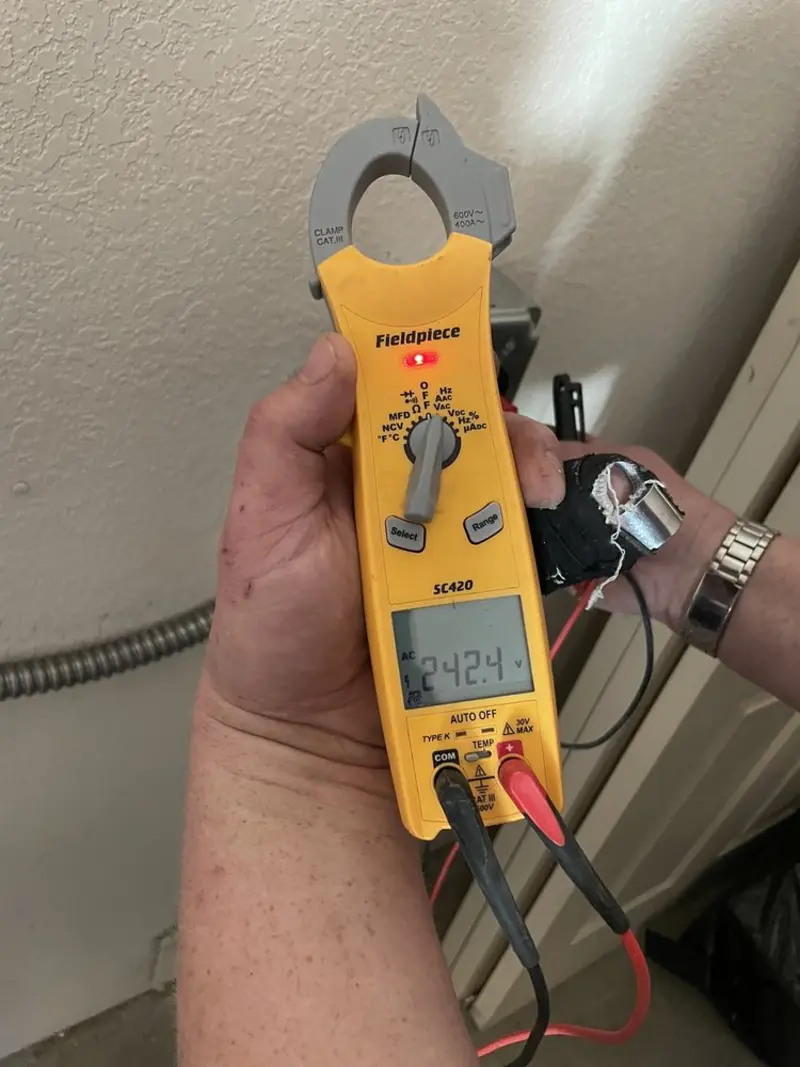 Voltage testing with clamp meter during Recessed Lighting Installation in South Hill
